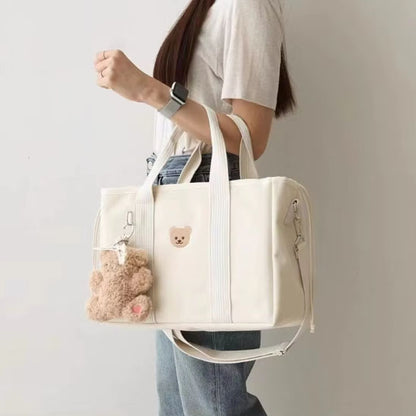 Sac a langer accroche au bras